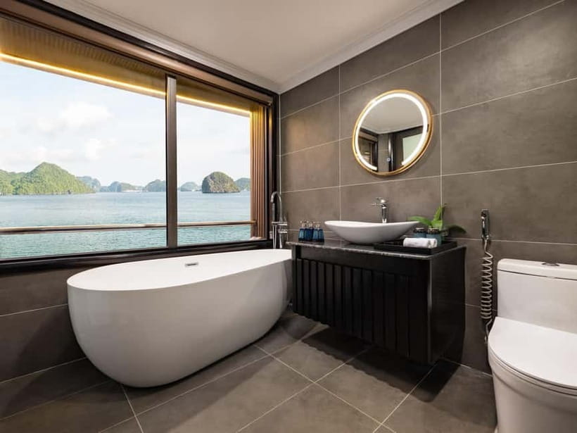 2-Day or 3-Day: Halong&Lan Ha Bay Cruise 5<em> balcony,bathtub – Key highlights I’d plan around’ /></p>
<ul>
<li><strong>Balcony + bathtub</strong> in a 5-star cabin, with daily bottled water and fresh-fruit extras if you ask</li>
<li><strong>Tra Bau water time</strong> for kayaking and swimming, plus a Jacuzzi option on board</li>
<li><strong>Chef-led cooking class</strong> (think spring rolls and other Vietnamese classics) followed by a sunset party</li>
<li><strong>Viet Hai Village</strong> visit by bicycle or electric car, including a local family house stop</li>
<li><strong>Dark & Bright Cave</strong> access by bamboo boat rowed by locals or via kayak</li>
<li>Onboard fun beyond sitting still: <strong>taichi on the sundeck</strong>, karaoke, squid fishing, and massage service</li>
</ul>
<h2 id="halong-and-lan-ha-bay-from-a-real-5-star-cabin-balcony-bathtub-and-quiet-downtime">Halong and Lan Ha Bay from a real 5-star cabin (balcony, bathtub, and quiet downtime)</h2>
<p><img width="820" height="615" decoding="async" src=