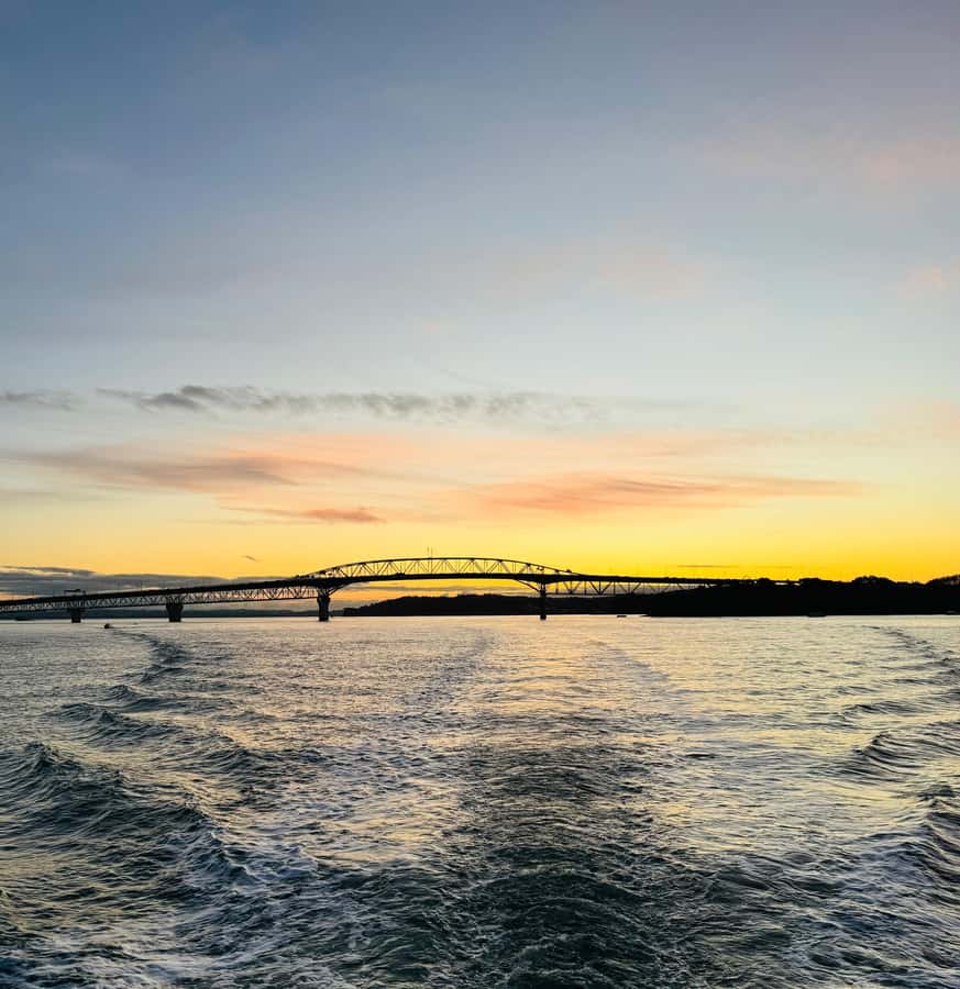 Auckland Sunset Harbour Cruise - Under Auckland Harbour Bridge: the view you came for