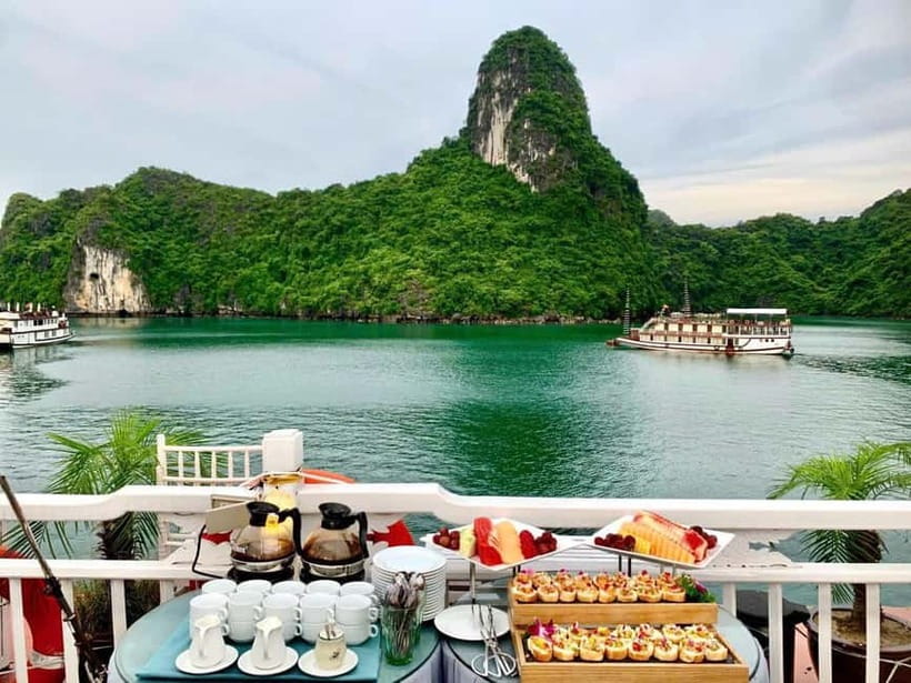 From Hanoi : 4-day Ninh Binh-Halong Bay Cruise with Balcony - Day 3 to Halong Bay: cruise check-in, kayaking through limestone, Titop views, then onboard party