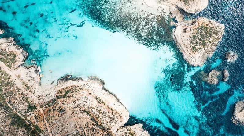 From Mellieha: Three Bay Cruise including the Blue Lagoon - Crystal Lagoon on Comino: sheltered swimming and sea caves