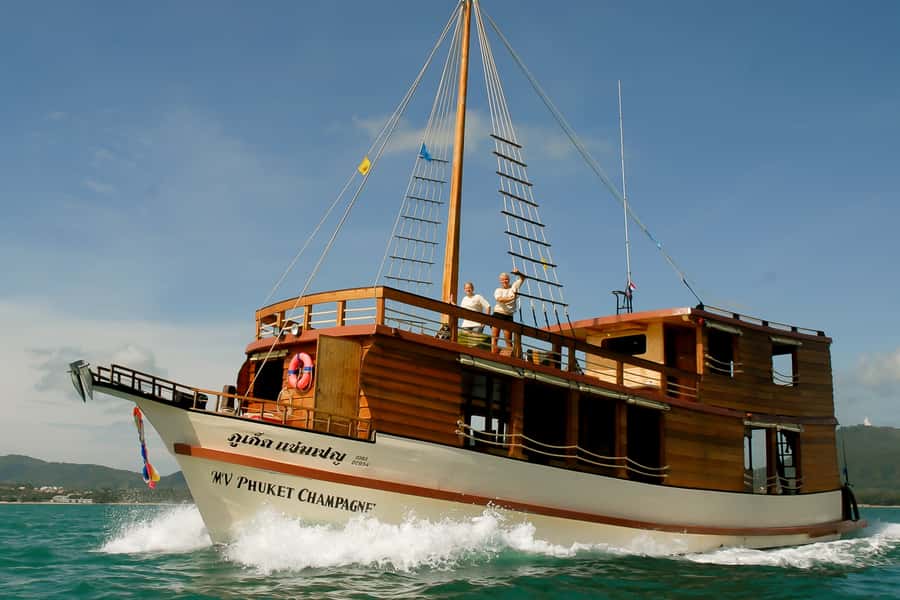From Phuket: Full-Day Phang Nga Bay Cruise with Meals - Karst cliffs and Koh Yao fishing scenes
