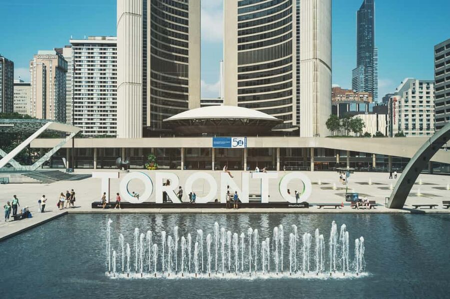 Toronto: Premium Driving Tour with Tower and Harbour Cruise - Getting Picked Up for a Fast Start in Downtown Toronto